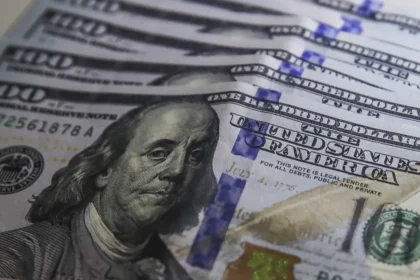 Cédulas e moeda de dólar americano